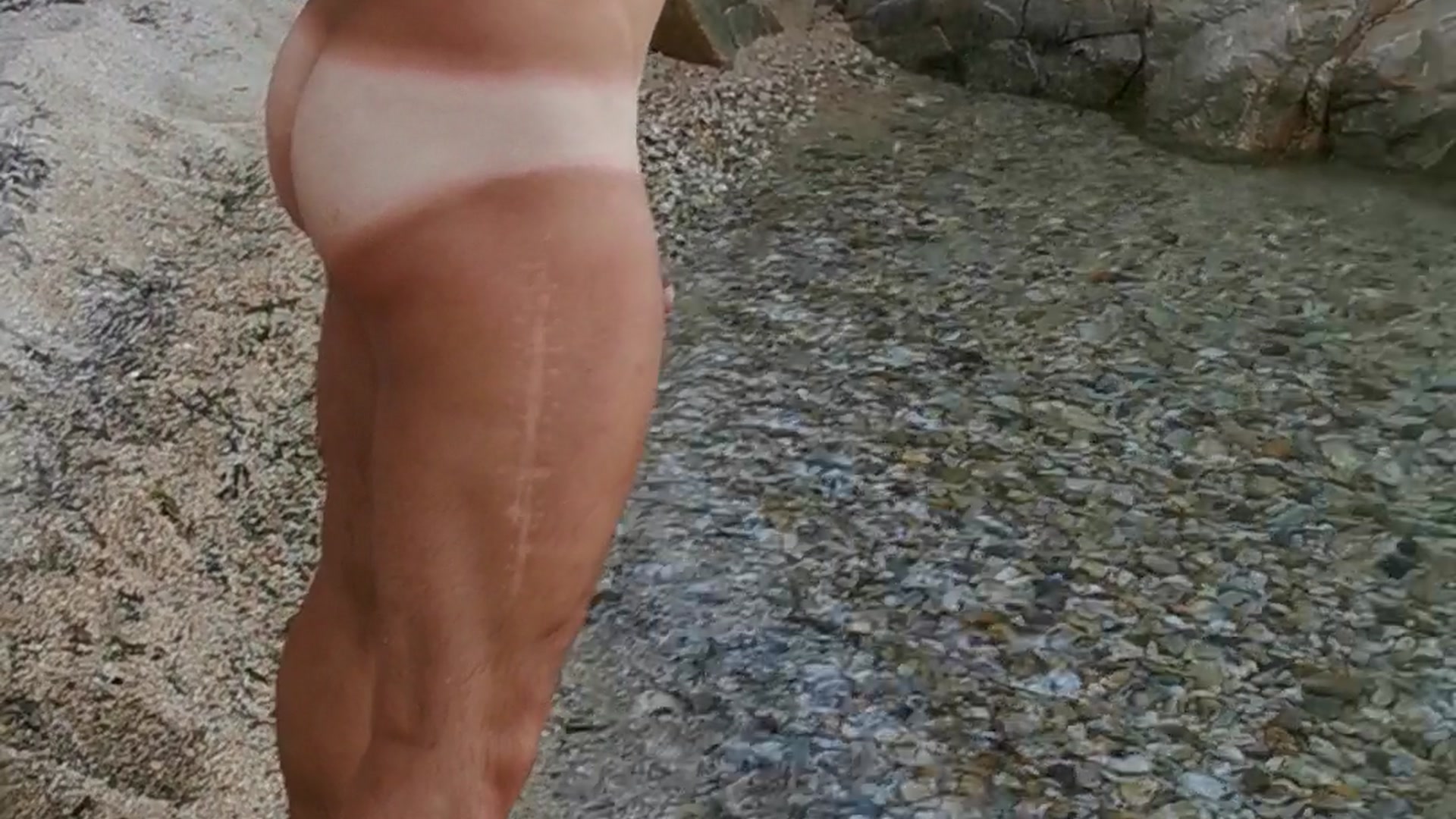 Showing off my tanline at a nudist beach