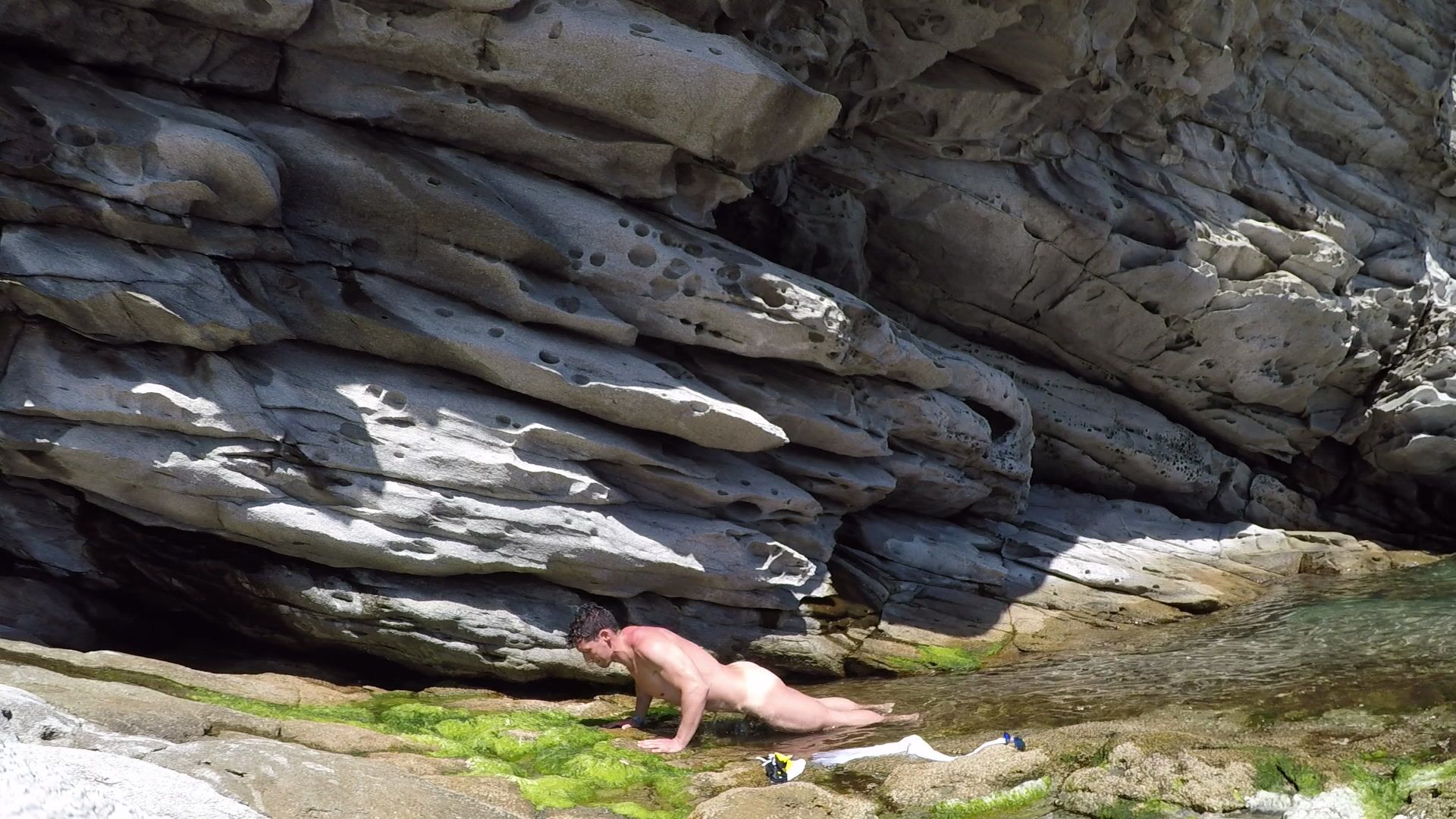 I love doing exercises at the beach. Check out my pullups on these rocks...naked, of course.