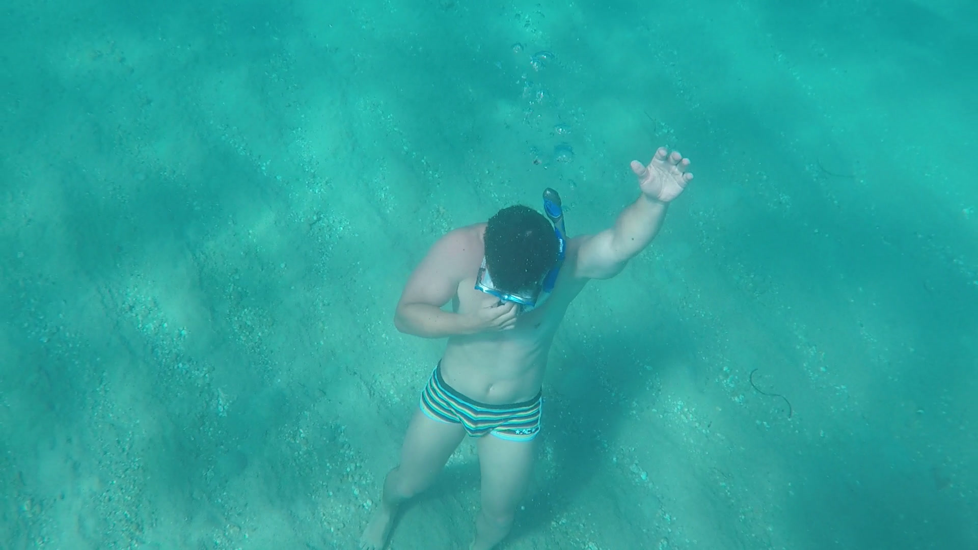 Doing some breathing exercises under water.
