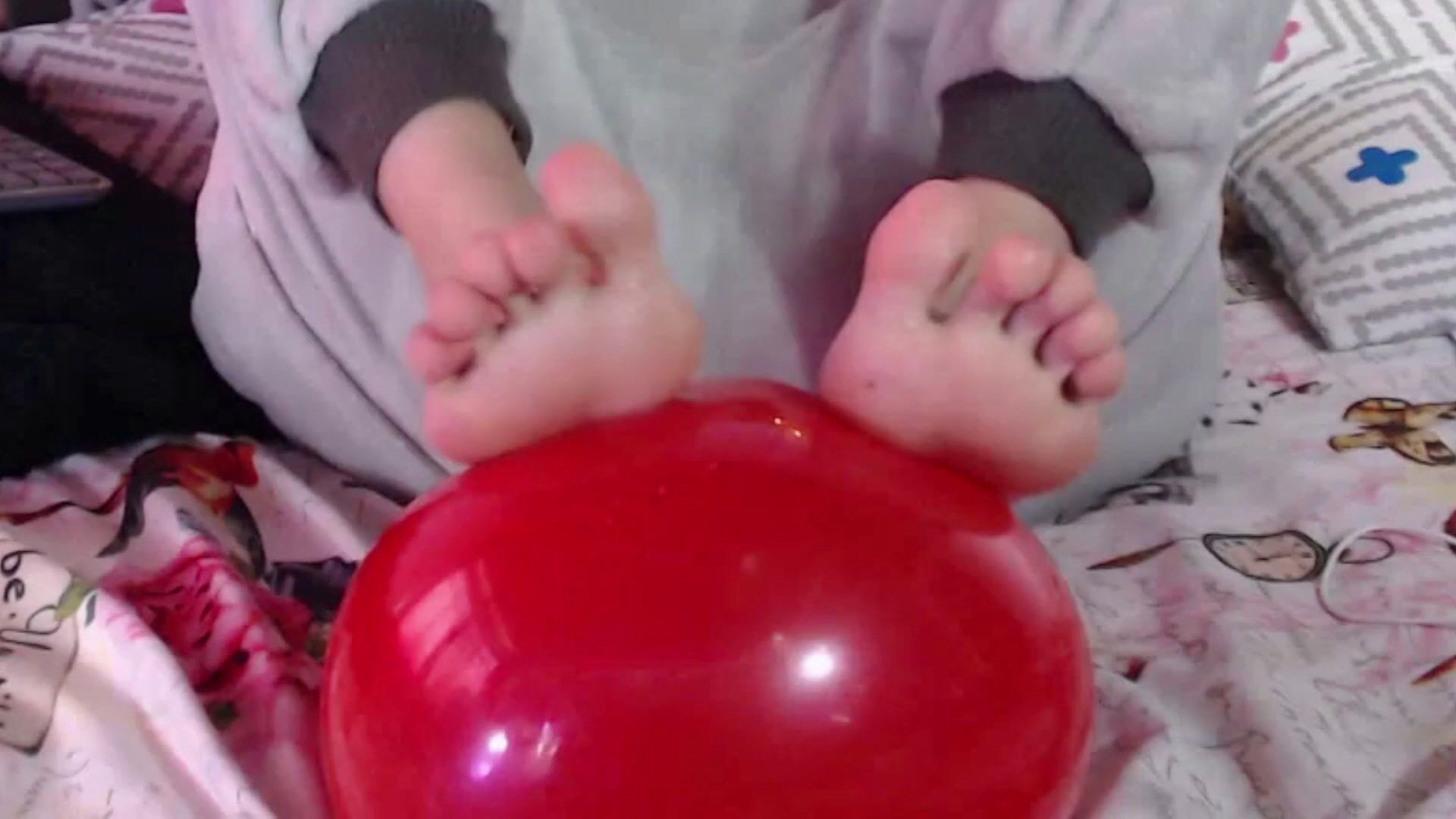 playful feet with balloon and bare ass