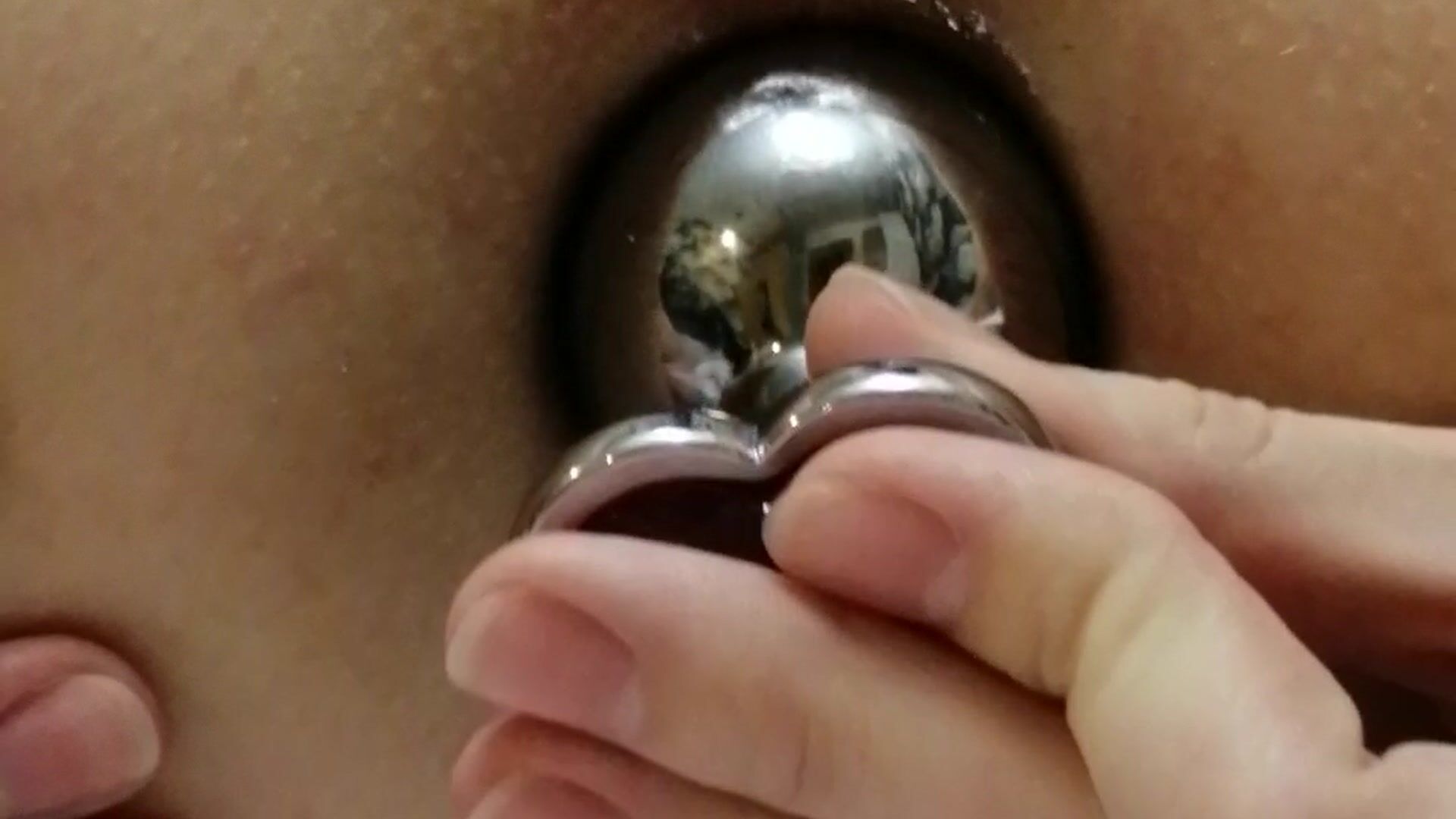 Play with pussy with anal plug close-up