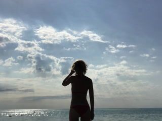 Sea. The sun. Red bikini