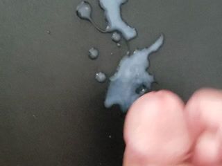 Cum shot on black surface.  Great view! - video by theclubist111 cam model