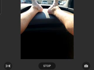 COCK and feet out in car in public parking lot