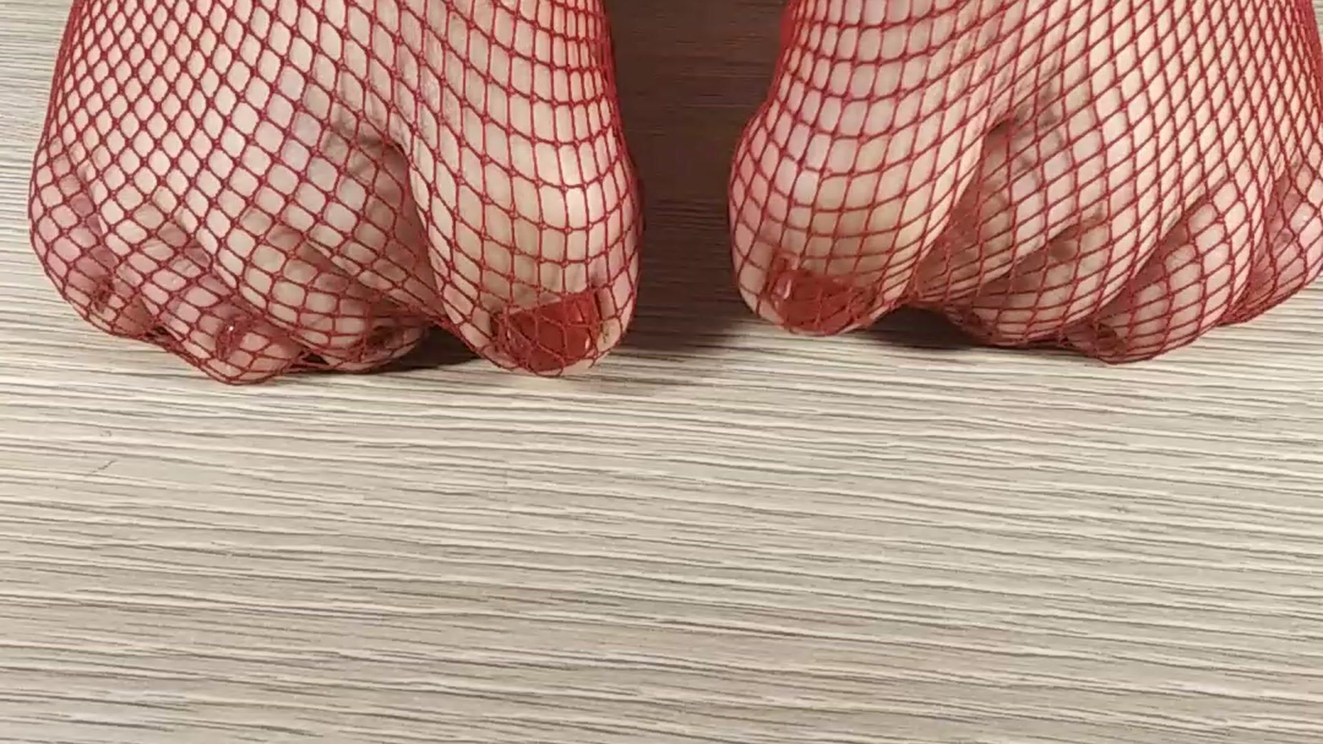 Foot fetish. red fishnet tights