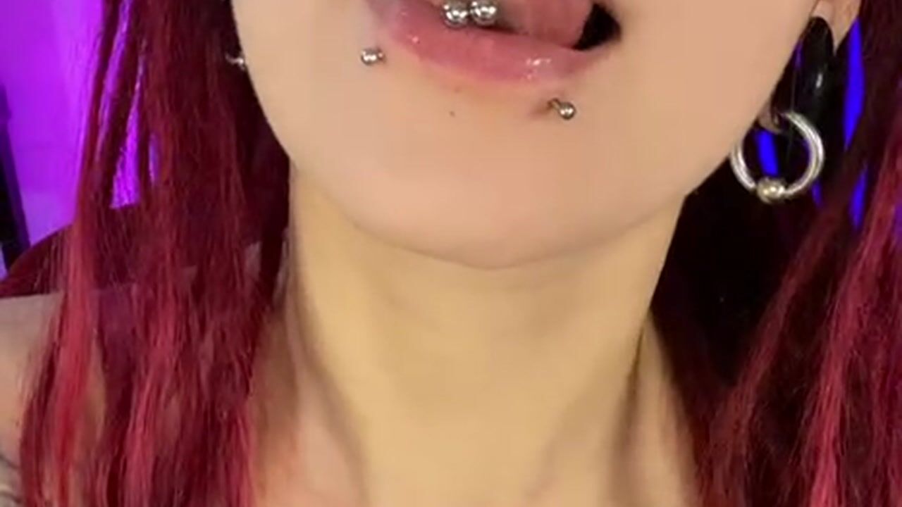 two piercings in the lip, two in the tongue