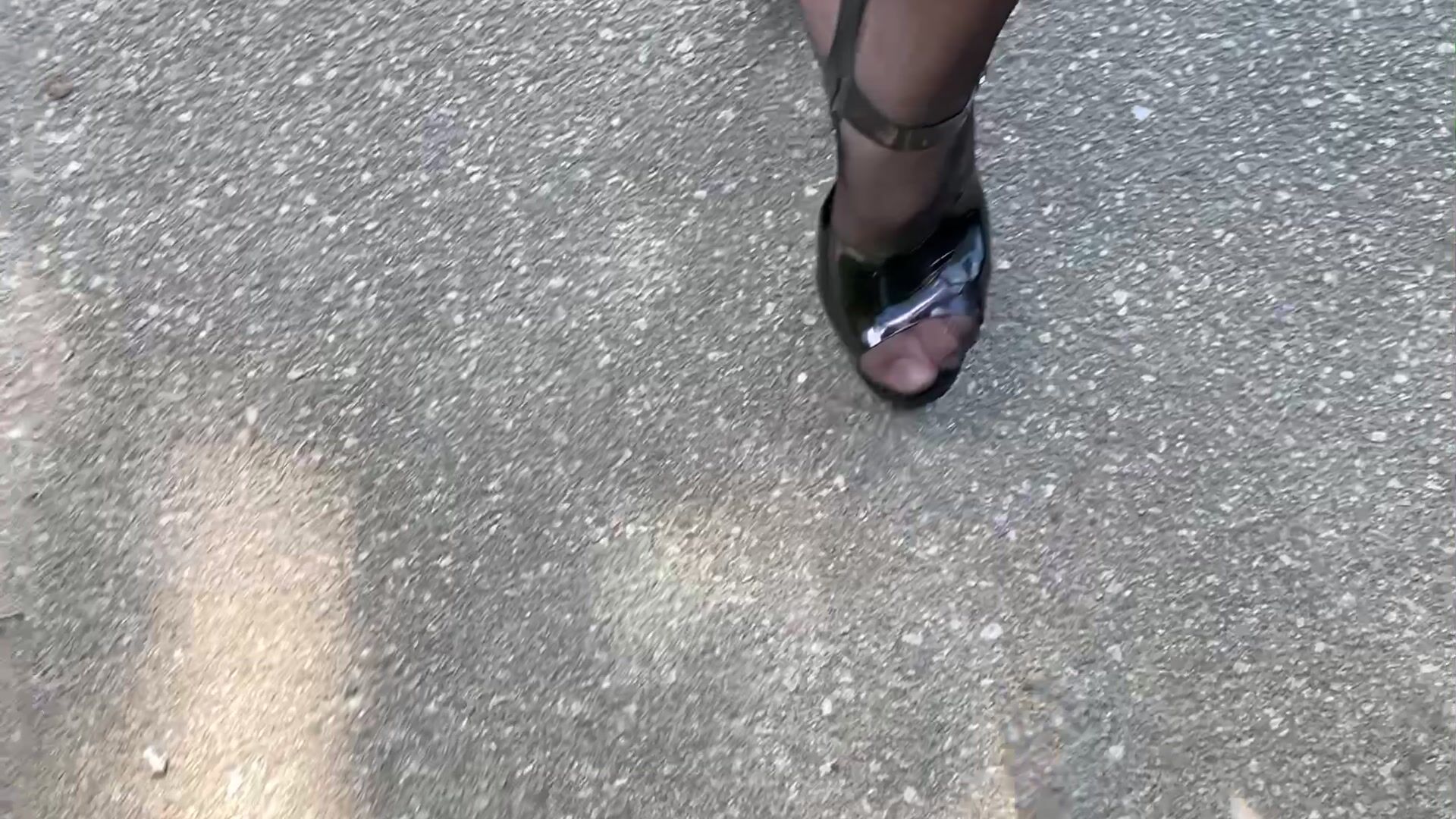 Black Heels walk with black stockings and shiny leggings