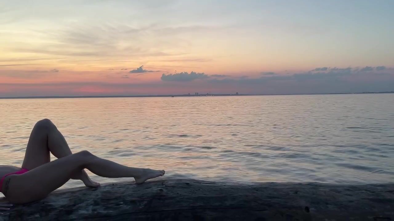 Mermaid against sunset background