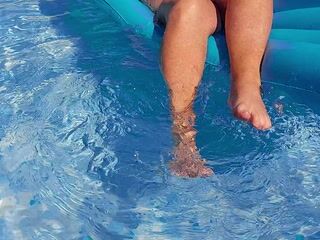 Feet play in pool