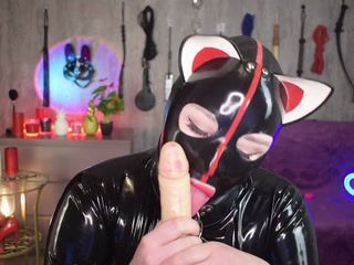 latex kitty in a collar licking your cock