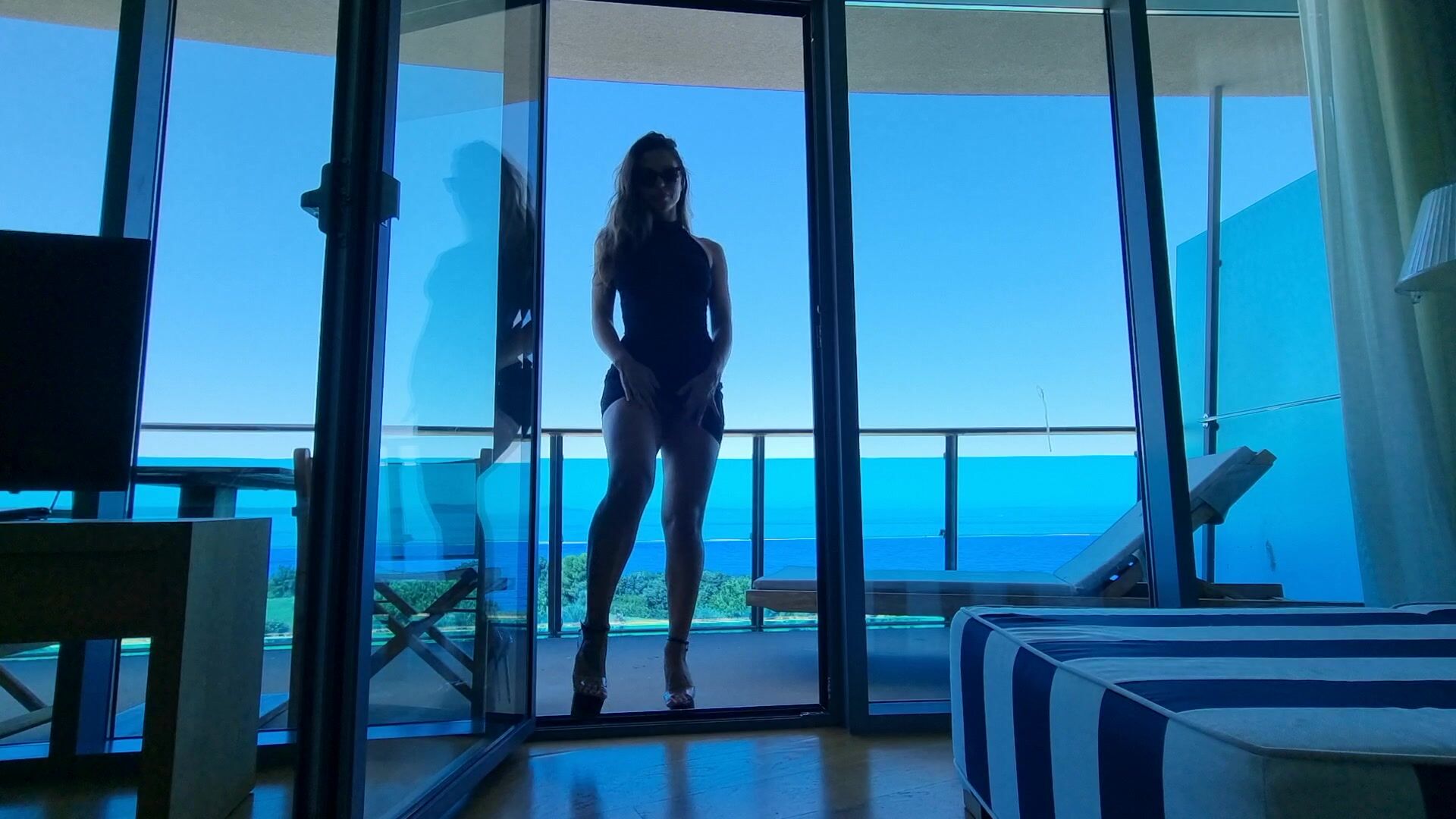 Tease u with sexy dress with no panties and hot high heels on balcony