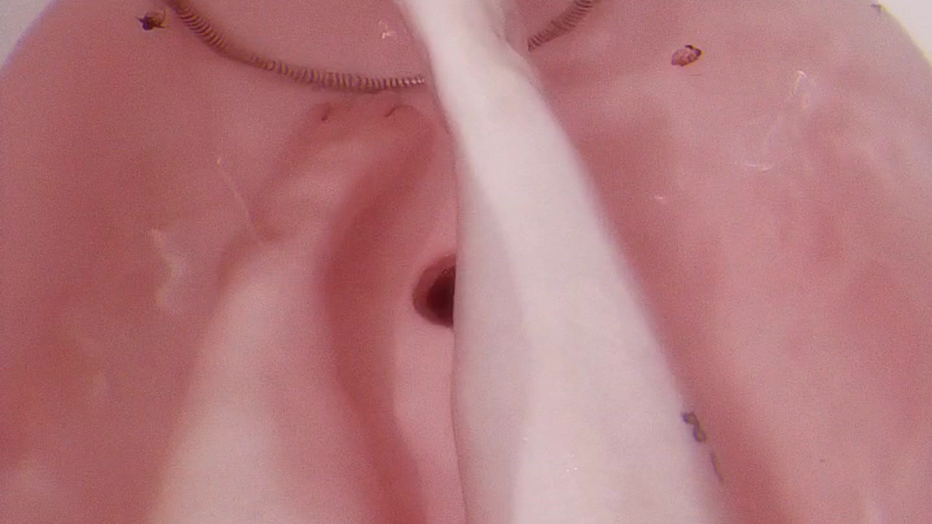 My bare legs in the bathroom with pink water ♥