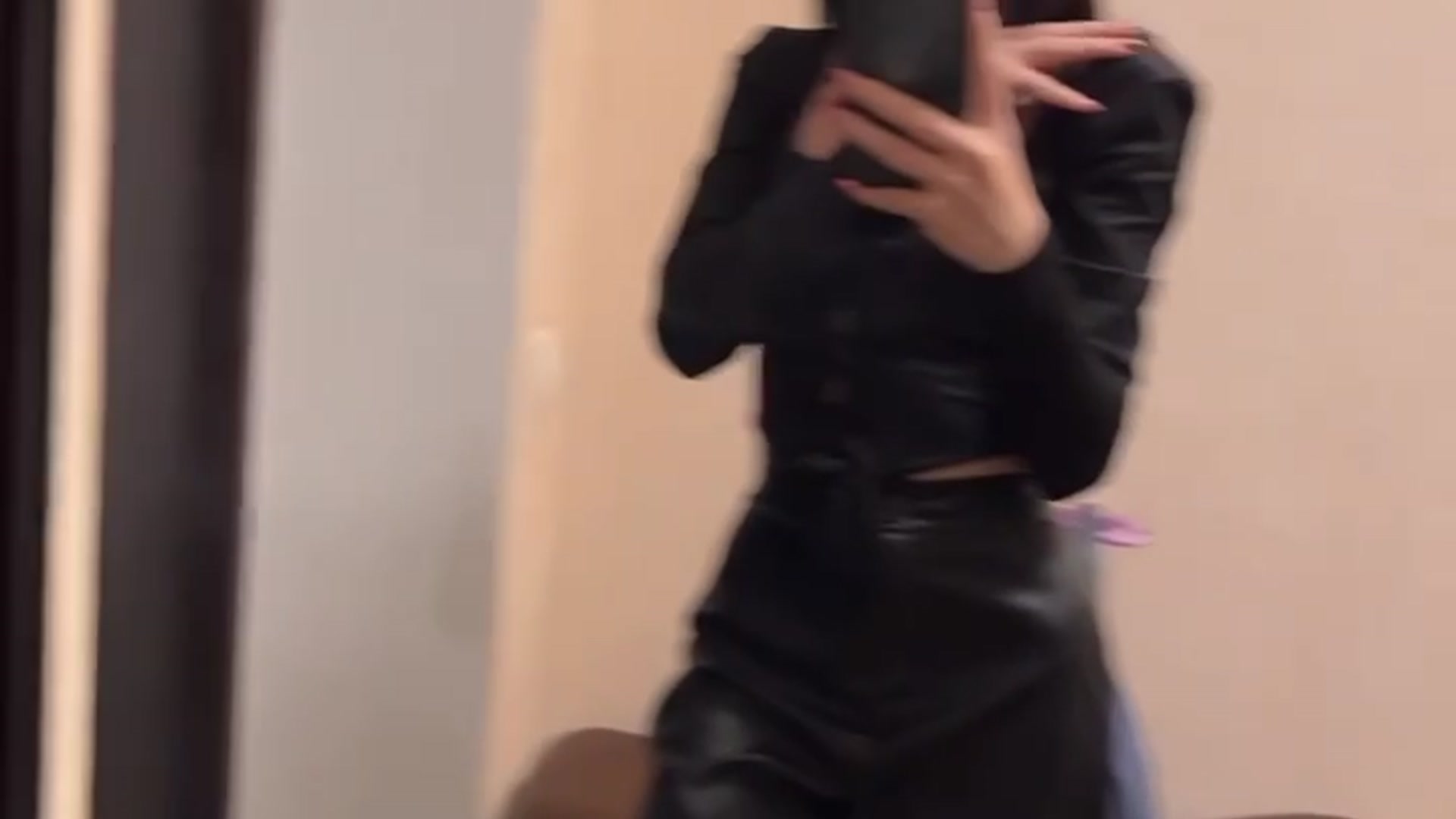 Nika shows off in front of the mirror
