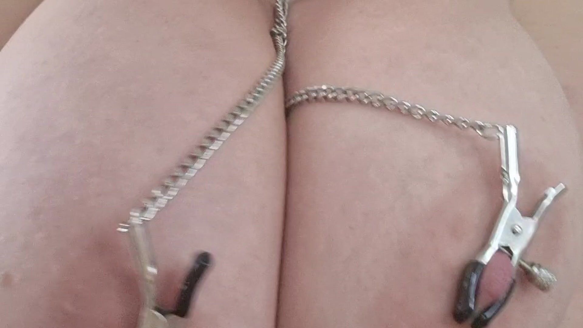 nipple play close up with clamps