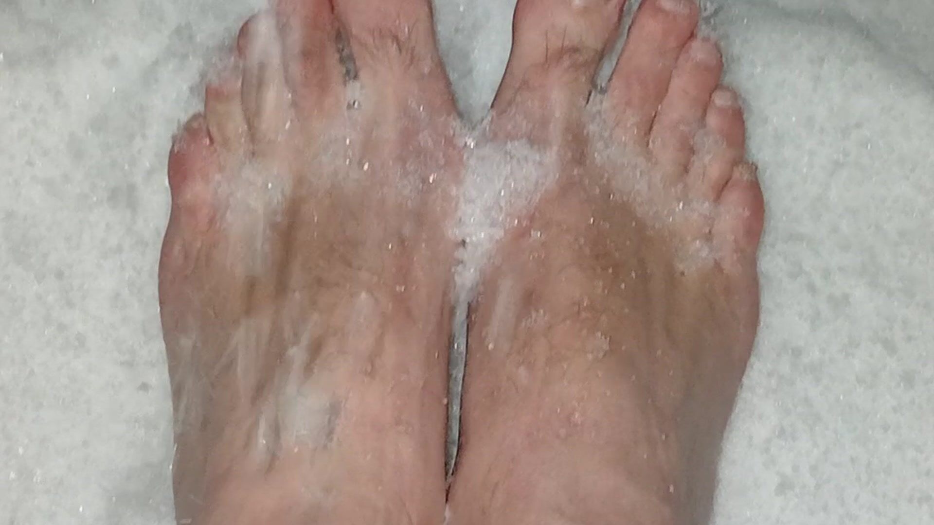 Feet in the snow barefoot