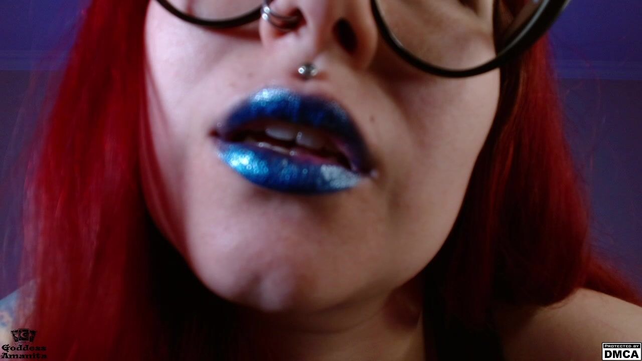 Mistress`s cruel smile with blue lipstick