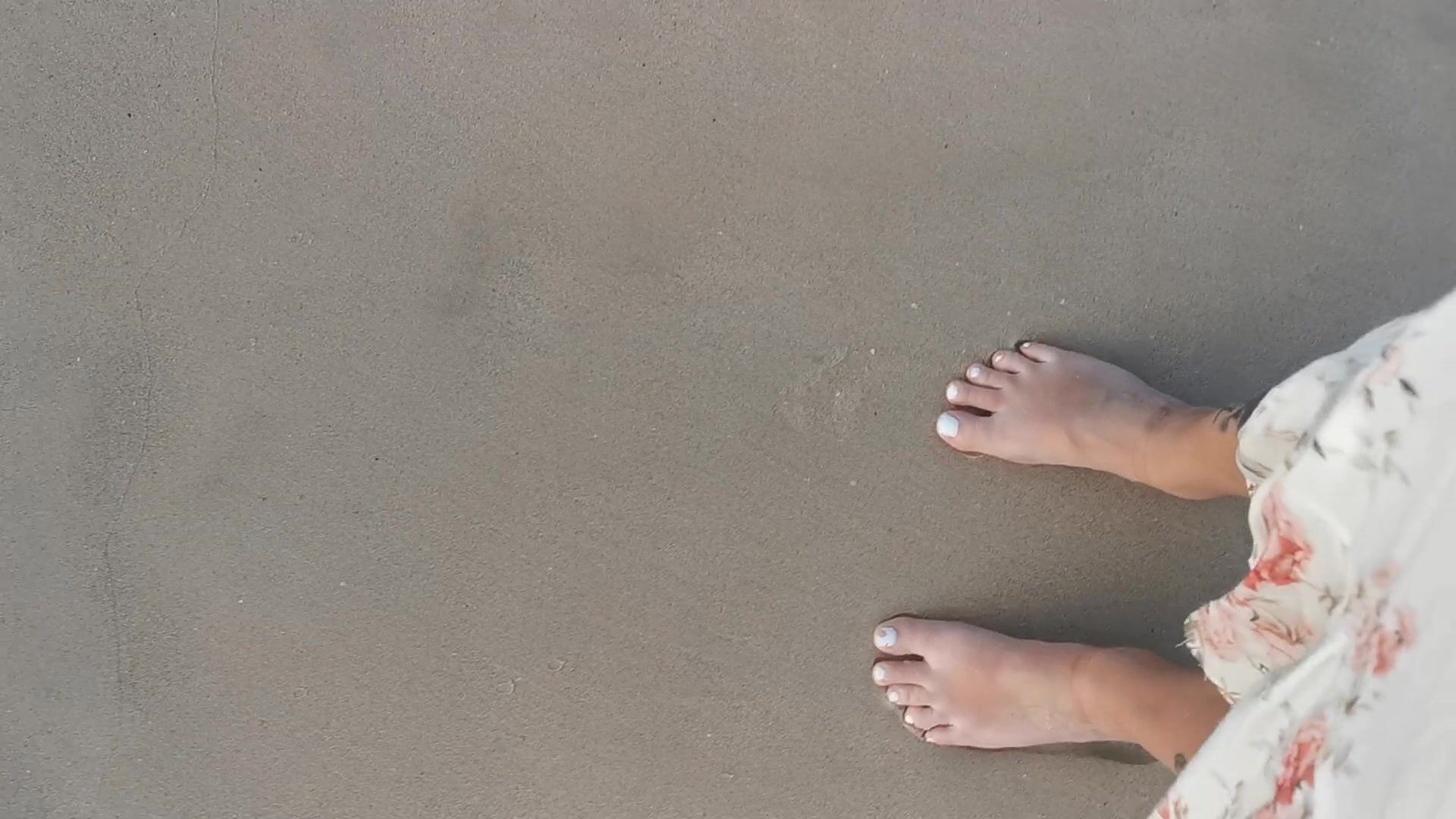 Naked feet at the beach